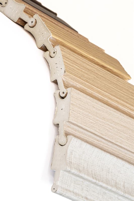 Articulated pieces in wood tones forming a curve